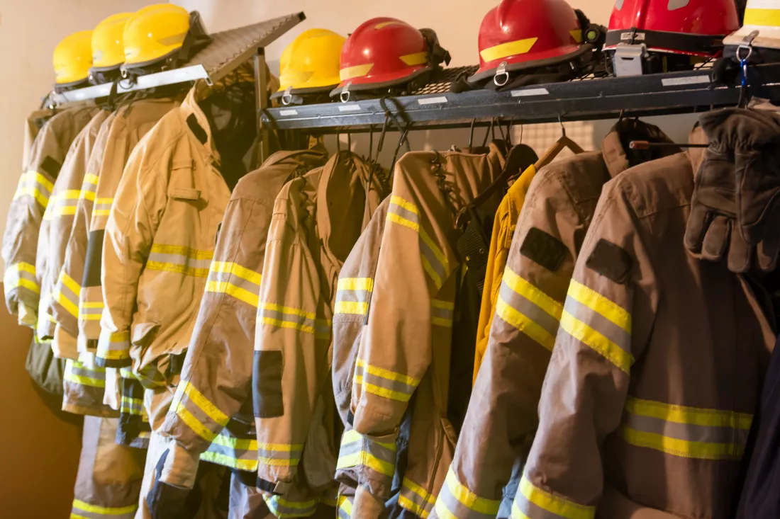 firefighter-s-uniforms-gear-arranged-fire-station